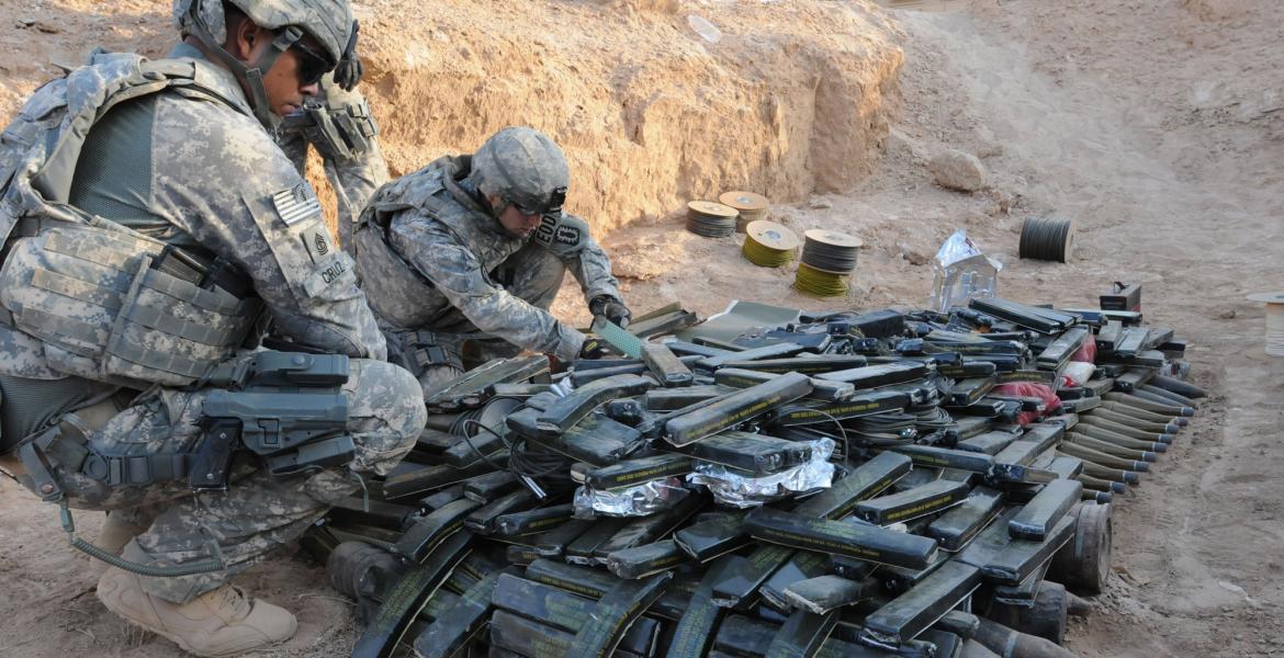 soldiers with weapons cache