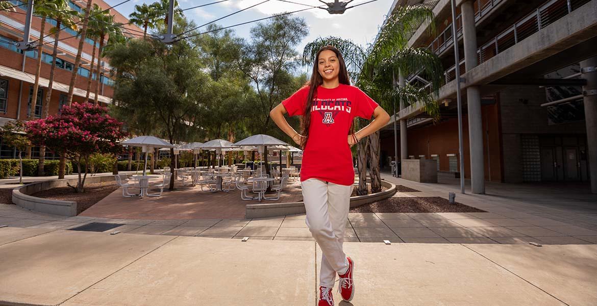 a student standing outside a building