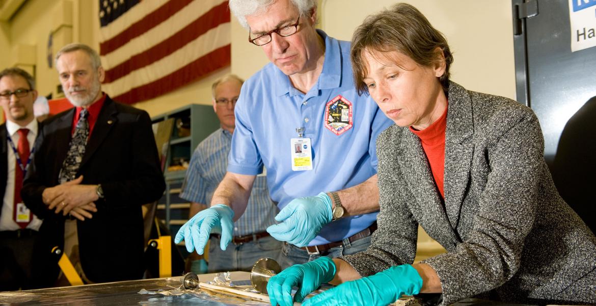 scientists examining sample material