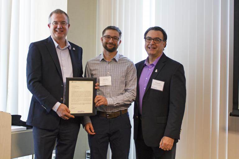 Daniel Higgins, outstanding senior in mining engineering, with nominator Moe Momayez and Craig M. Berge Dean David Hahn.