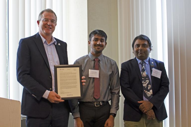 Ravi Teja Nallapu, outstanding graduate student in aerospace engineering, with nominator Jekan Thanga and Craig M. Berge Dean David Hahn.