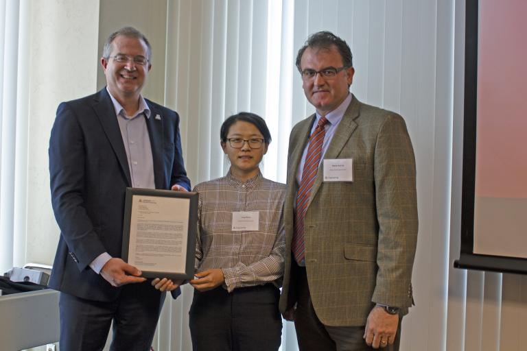 Yin Zhang, outstanding graduate student in biosystems engineering, with nominator Murat Kacira and Craig M. Berge Dean David Hahn.