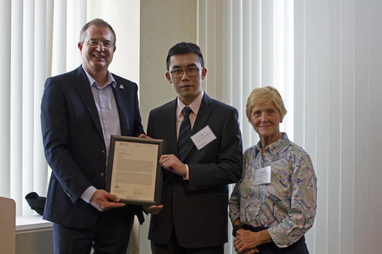 Ao Li, outstanding graduate student in electrical and computer engineering, with nominator Linda Powers and Craig M. Berge Dean David Hahn.