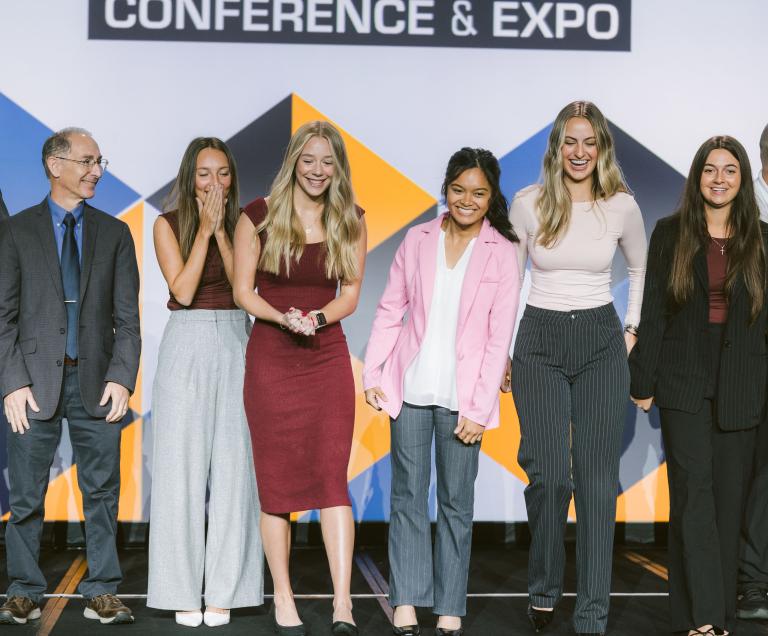 (From left) faculty adviser Dean Papajohn, Lily Trenkamp, Lauren Johnson, Reuel Florendo, Kenadee Carruthers and Macie Balkan react to the announcement of the team’s win. Johnson also won the award for best individual presenter. “The team demonstrated a mastery of collaboration and creativity that left a lasting impression on the judges,” stated DBIA’s blog.