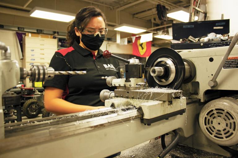 Emily Bauers working on a piece for the Baja vehicle