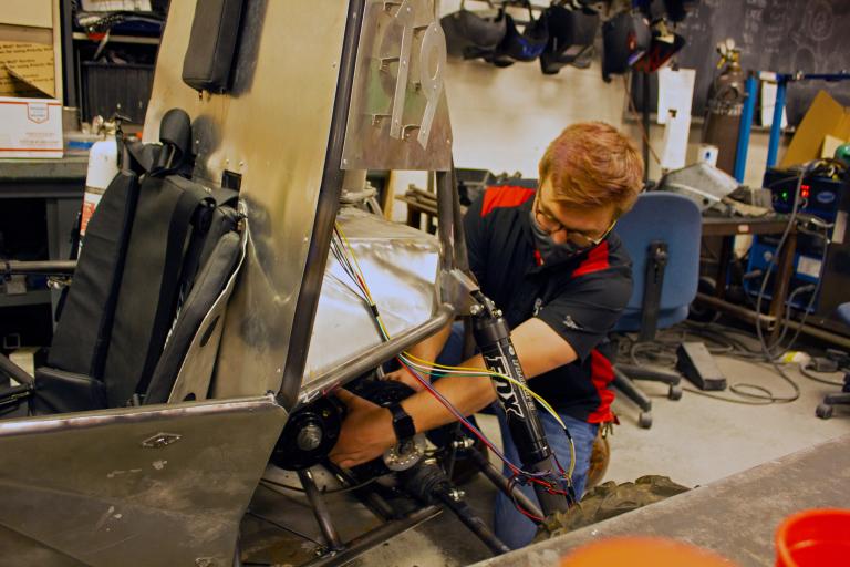 Erik Knowles working on the Baja SAE vehicle