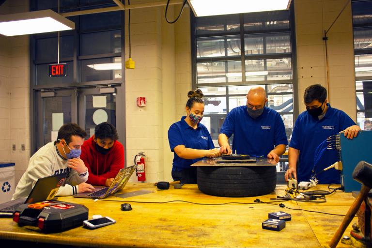 Team 21032 in the Aerospace and Mechanical Engineering Building machine shop