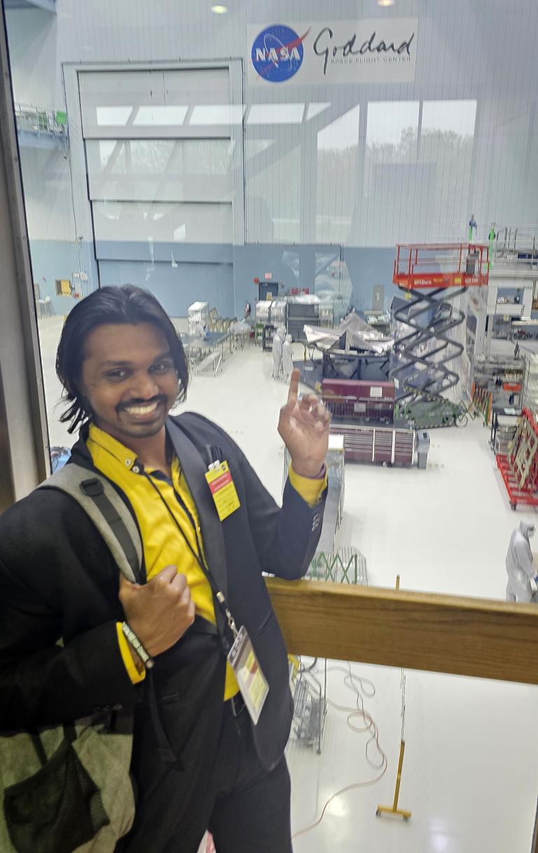 Athip Thirupathi Raj checks out the Nancy Grace Roman Space Telescope, being assembled at NASA’s Integration, Assembly and Test Building.