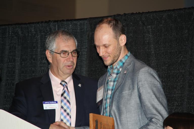 Young Professional Achievement Award recipient Ryan Kanto, right, with Dean Jeff Goldberg