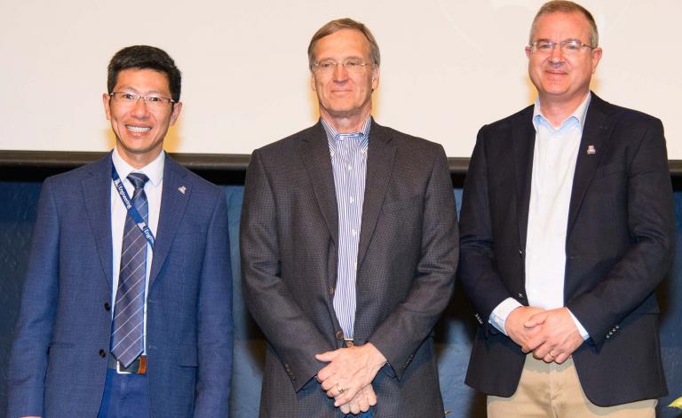 Hummel poses with the electrical and computer engineering department head and the college's dean.