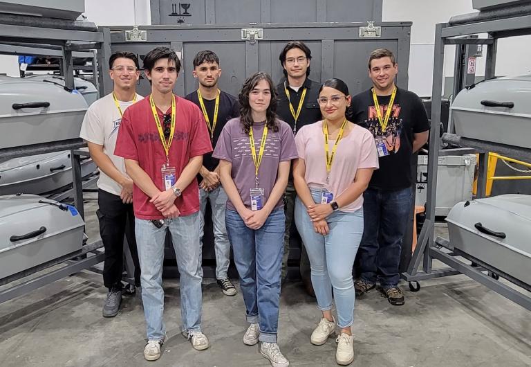 a group of students in a manufacturing environment