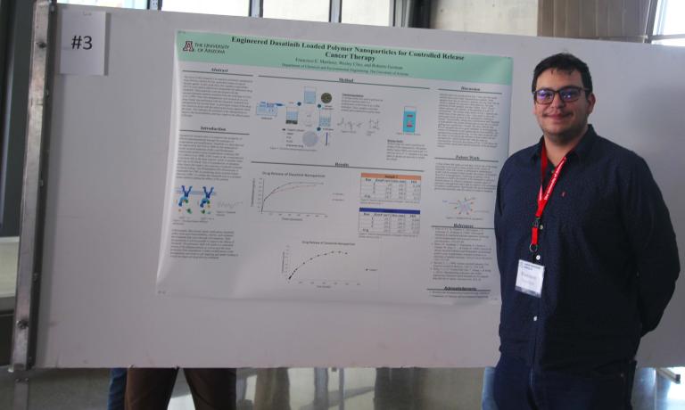 Francisco Martinez poses with his research poster