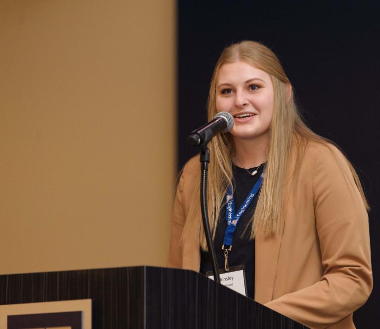 Ainsley Limesand at the podium