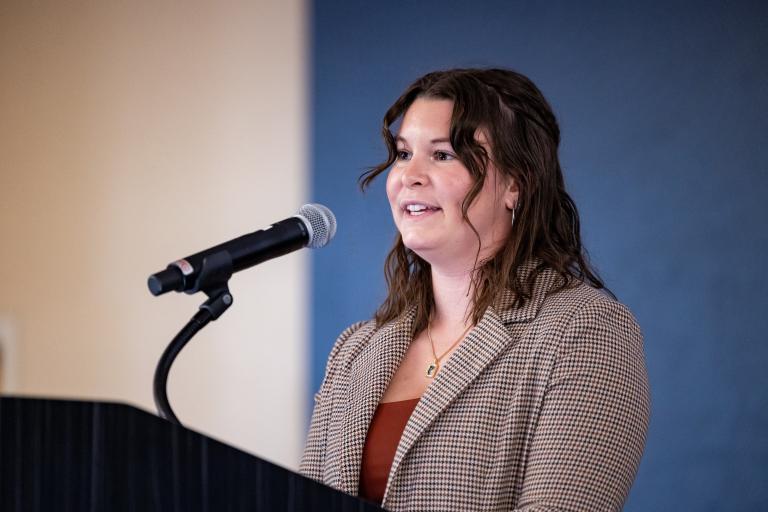 Spatz speaks at a podium