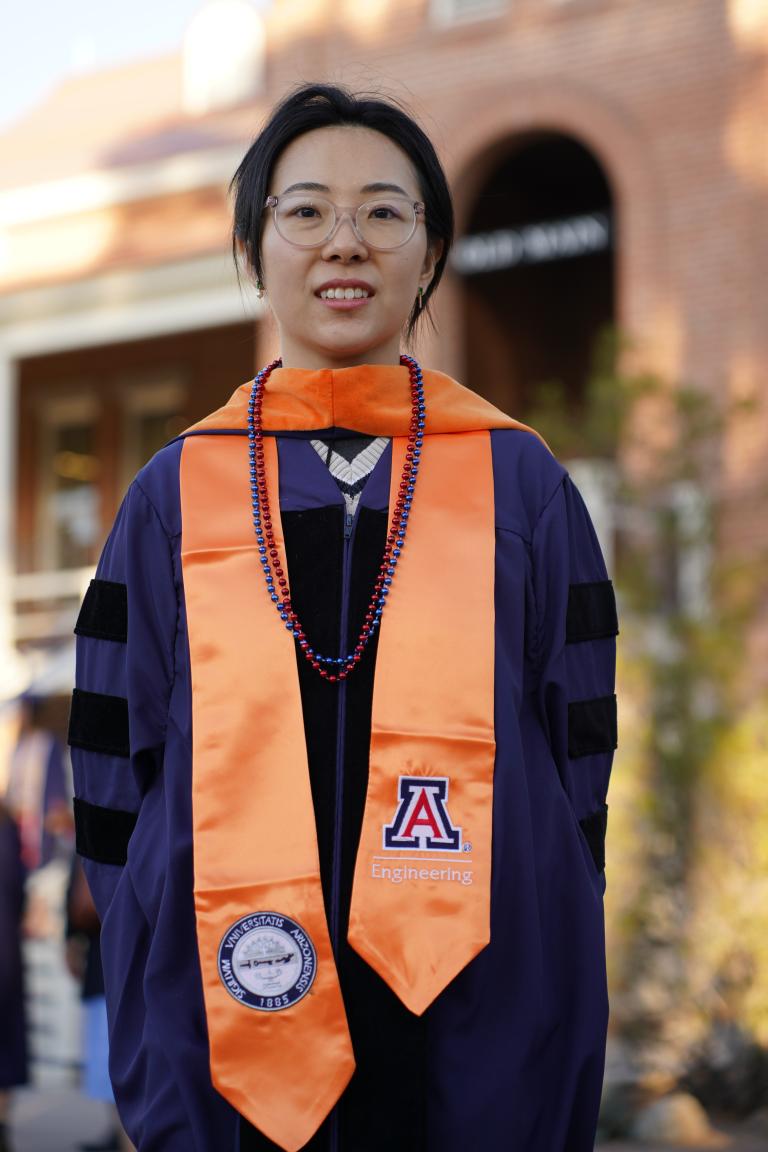 Yi Zhang stands in front of Old Main