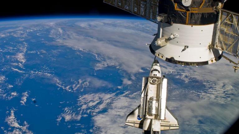 space shuttle docks with international space station