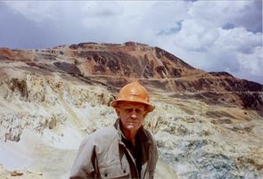 J. David Lowell wearing a hard hat at a mine.