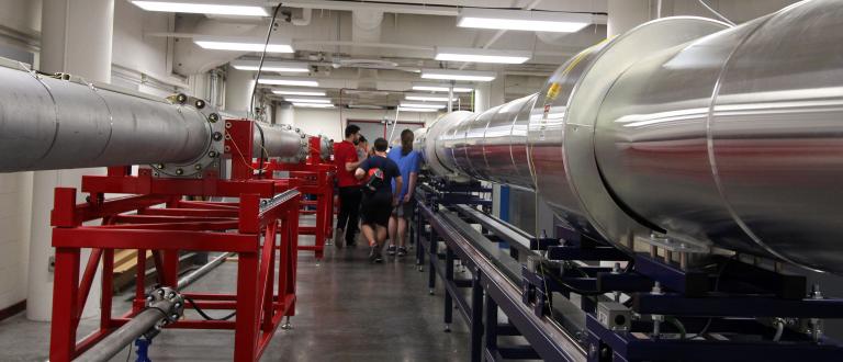 students tour a wind tunnel facility