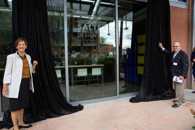 The grand reveal: Peter and Nancy Salter pull back the curtain on the new facility.