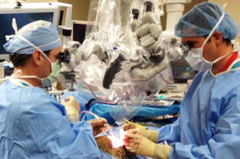 Doctors perform brain surgery at Banner - University Medical Center Tucson. 