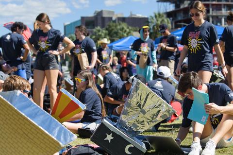 Many students work outdoors with homemade solar ovens