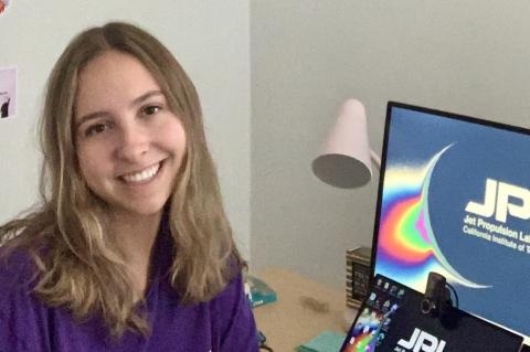 Ariel Shaver next to a NASA JPL computer.