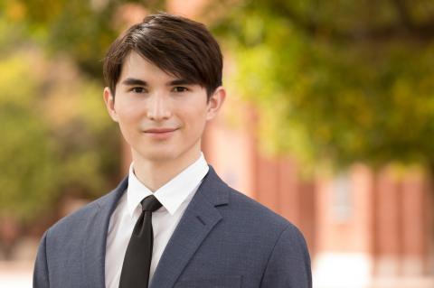 Daniel Wieland wearing a suit and tie.