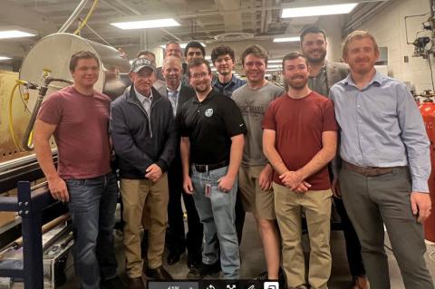 a large group of people in a wind tunnel testing facility