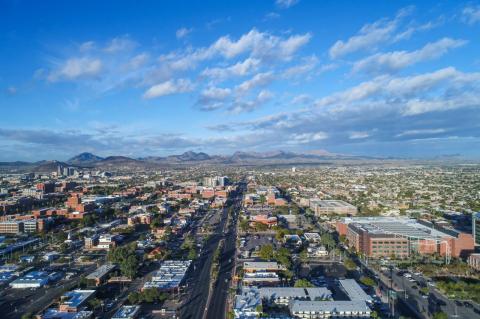 An aerial view of Tucson, looking from the east, including Speedway Boulevard and parts of the University of Arizona campus.