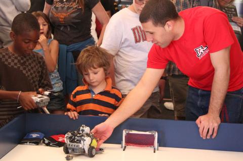 kids playing with robots