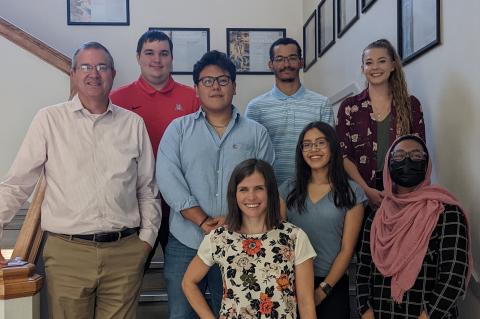 REAL Work poster session participants pose for a photo with Dean David Hahn and Noel Hennessey