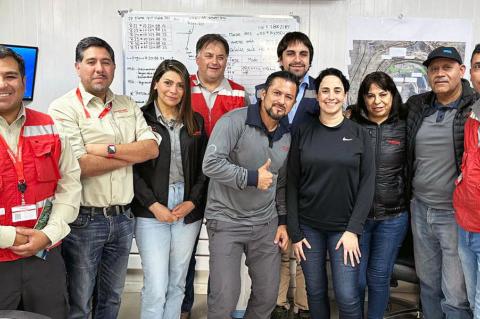 A group stands in a mining office