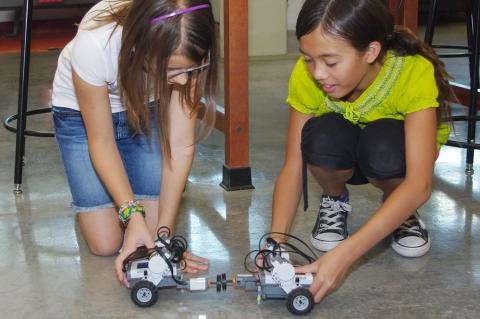 kids playing with robots