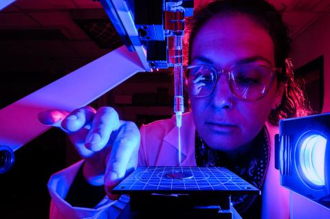 Vicky Karanikola works with water purification equipment in a lab