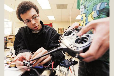 student with robot