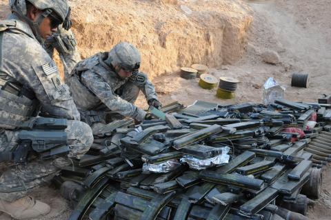 soldiers with weapons cache