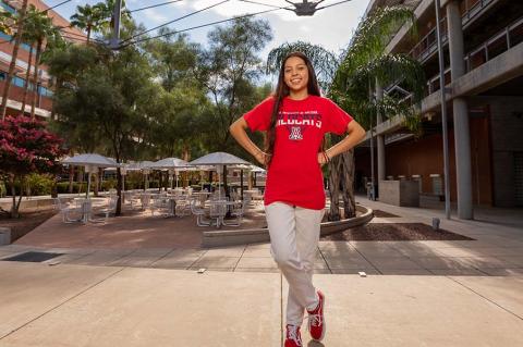 a student standing outside a building