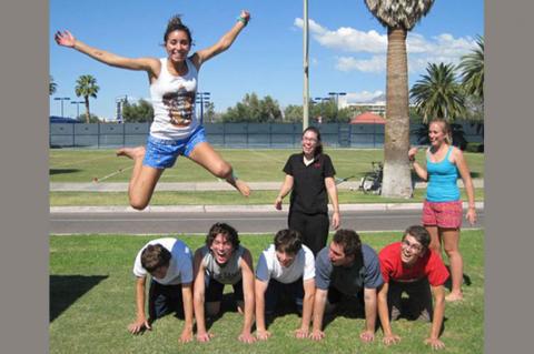 students doing acrobatics