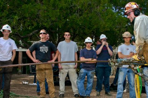 mining engineering students drilling rocks