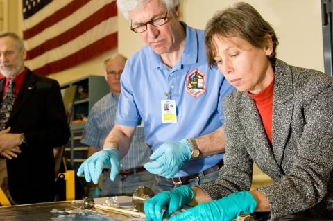 scientists examining sample material