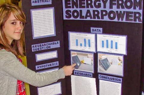 student presenting project at science fair