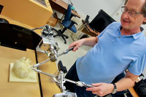 University of Arizona Distinguished Professor Jerzy Rozenblit demonstrates his Computer-Aided Surgical Trainer.