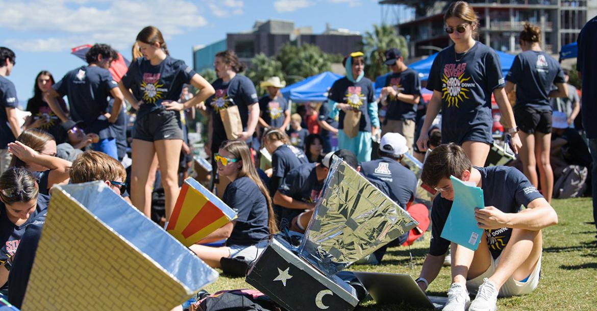 Many students work outdoors with homemade solar ovens