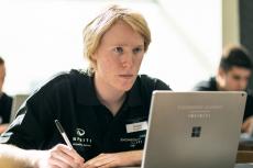 Andre Schreiber looking intently at a laptop screen.