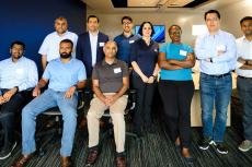 a group of faculty members posing for a photo