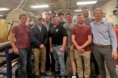 a large group of people in a wind tunnel testing facility