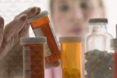 a pharmacist examines medications