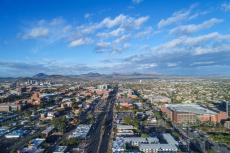 An aerial view of Tucson, looking from the east, including Speedway Boulevard and parts of the University of Arizona campus.