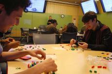 Students work with Lego blocks in a classroom