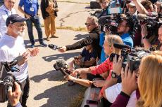 a news conference at the sample landing site